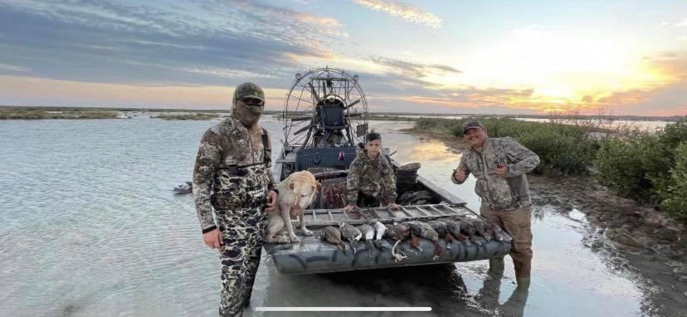 Cast and blast crew at the airboat with a morning limit of ducks