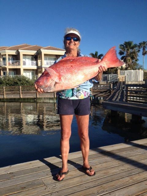Angler with a red snapper taken offshore in the Gulf