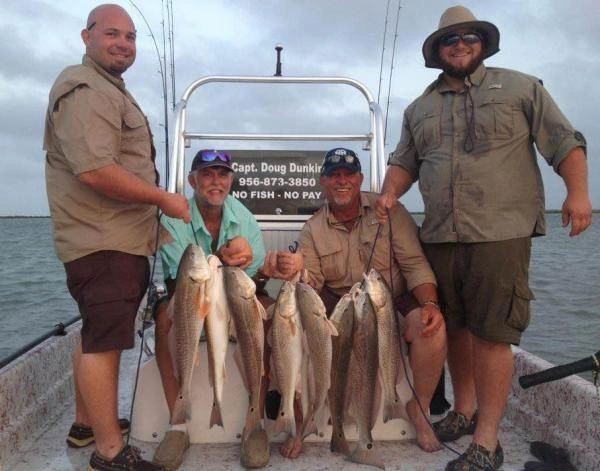 Buddy trip crew with their redfish on the Lower Laguna Madre